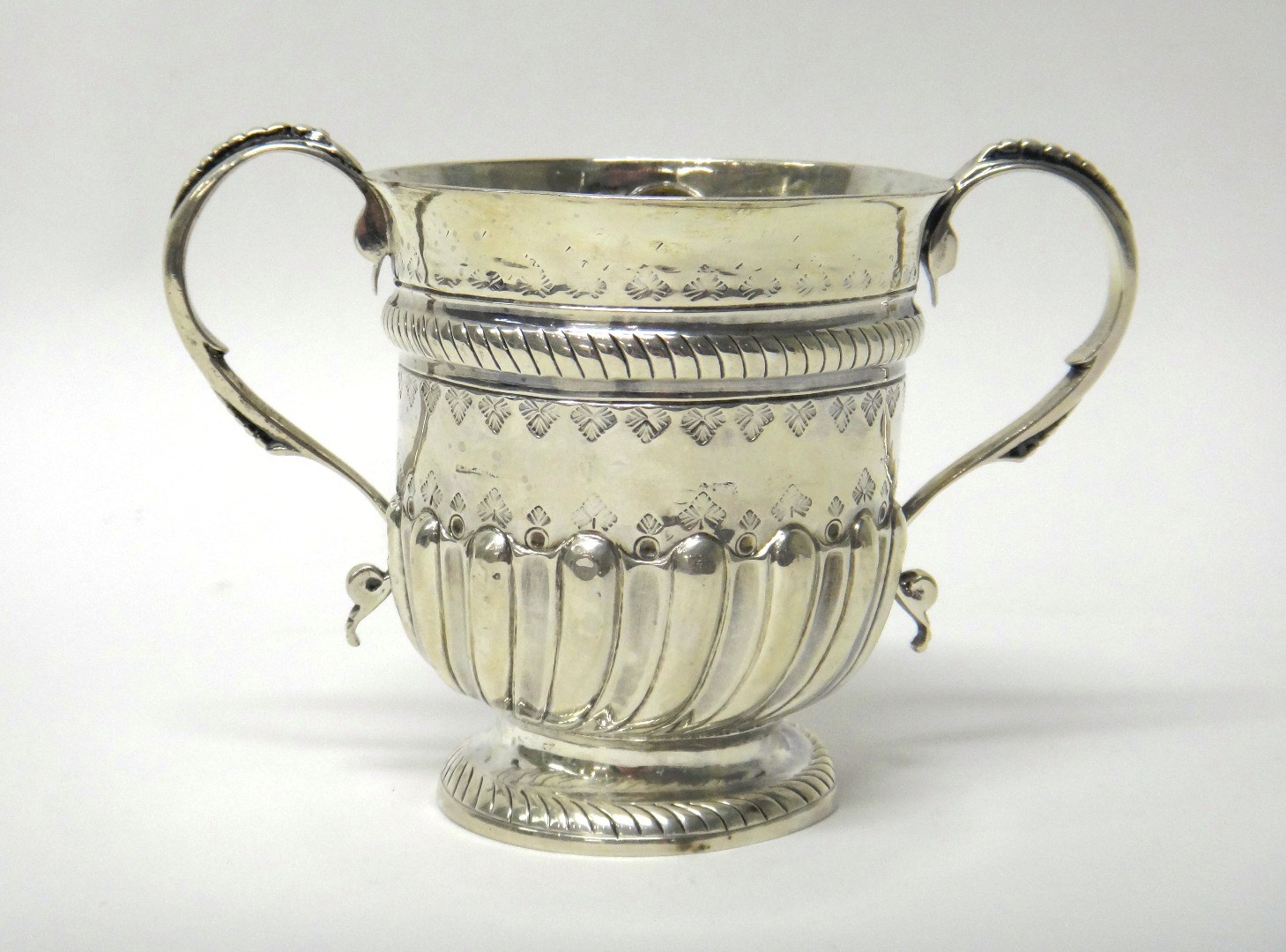 Appraisal: A George I Britannia silver twin handled porringer with later