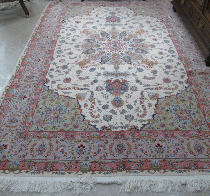 Appraisal: PERSIAN SILK AND WOOL CARPET hand knotted in a floral