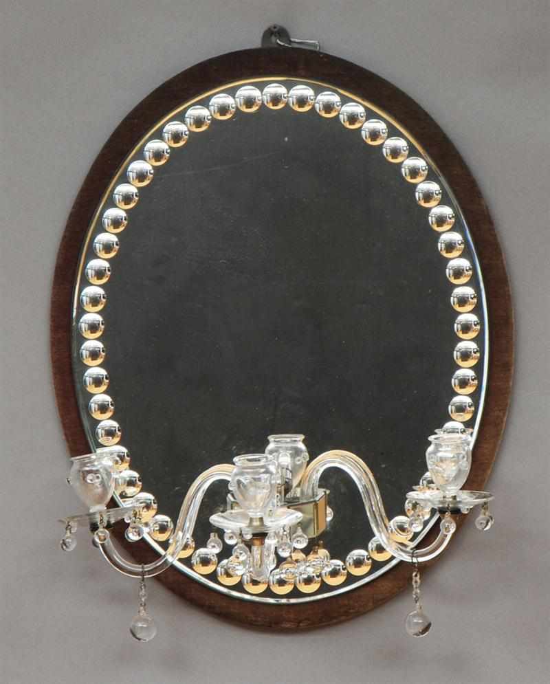 Appraisal: ENGLISH OVAL GLASS AND VELVET GIRANDOLE MIRROR Fitted with three