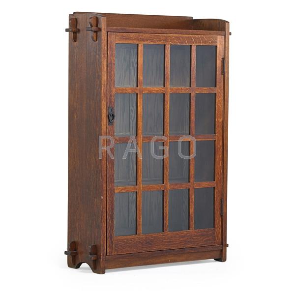 Appraisal: GUSTAV STICKLEY Single-door bookcase Condition Report Skinned finish some stains