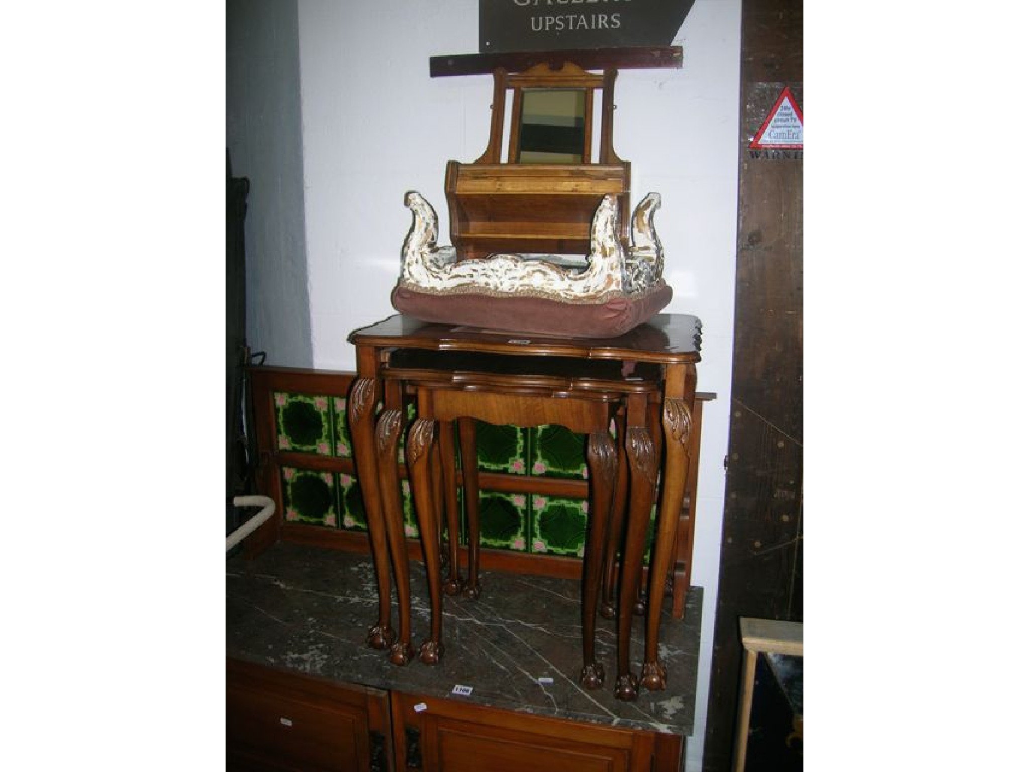 Appraisal: A nest of three reproduction graduated walnut occasional tables of