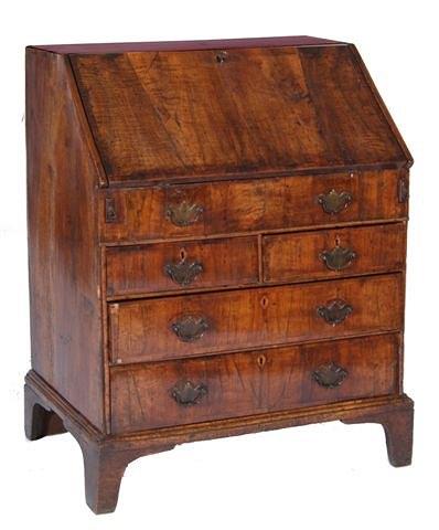 Appraisal: AN TH CENTURY WALNUT SMALL BUREAU with stepped interior with