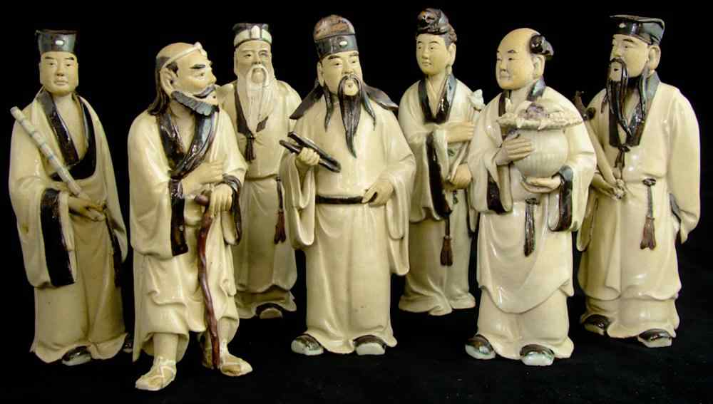 Appraisal: SEVEN CHINESE GLAZED POTTERY IMMORTALS The six male and single