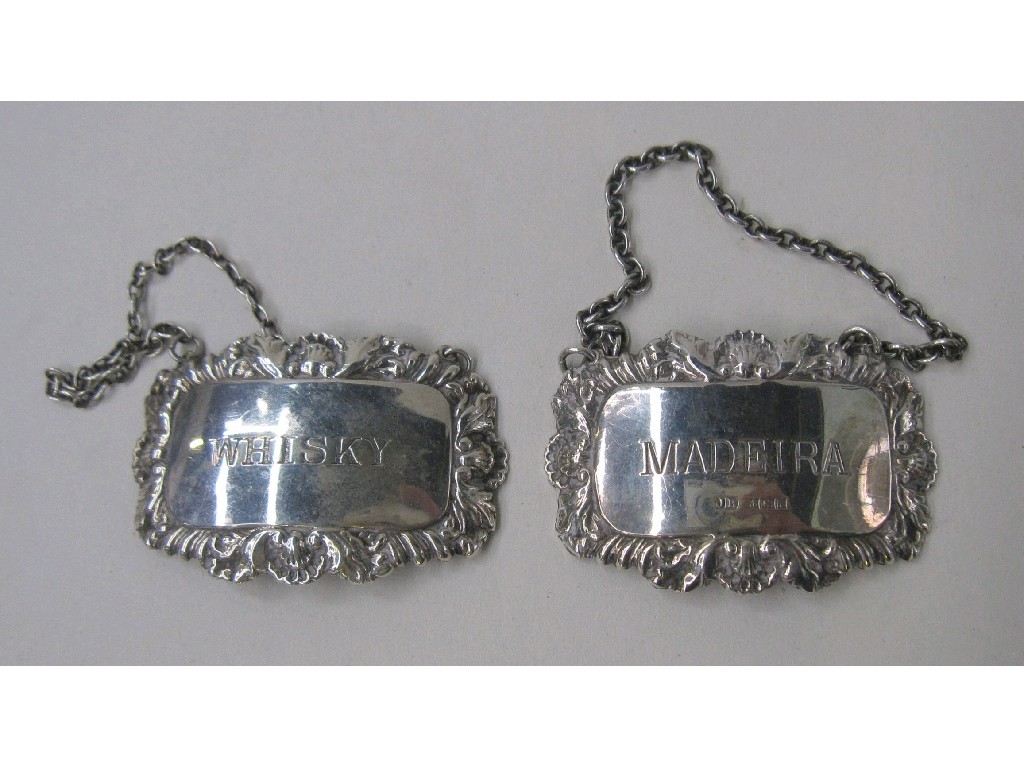 Appraisal: Lot comprising two silver decanter labels