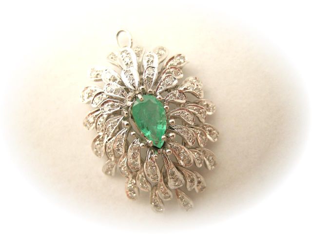 Appraisal: k white gold emerald and diamond brooch pendant with with