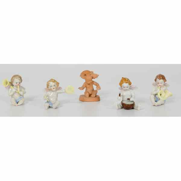 Appraisal: German Porcelain Putti Figurines Plus German Four porcelain putti figurines