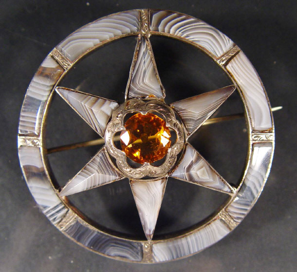 Appraisal: Silver and hardstone star shaped brooch