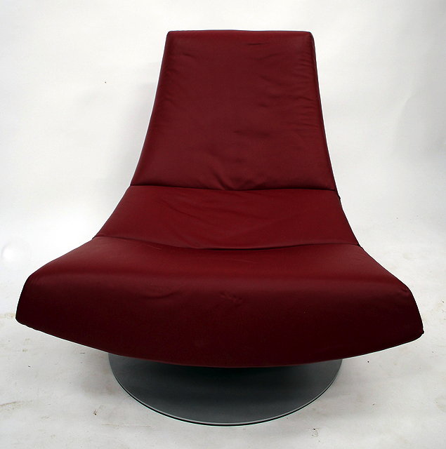 Appraisal: A CONTEMPORARY RED LEATHER UPHOLSTERED CHAIR OF SHAPED OUTLINE on