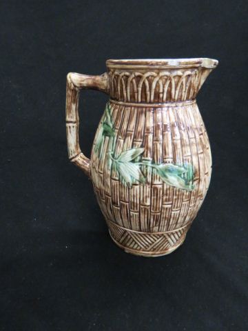 Appraisal: Majolica Pottery Pitcher with bamboo design tall rim chip