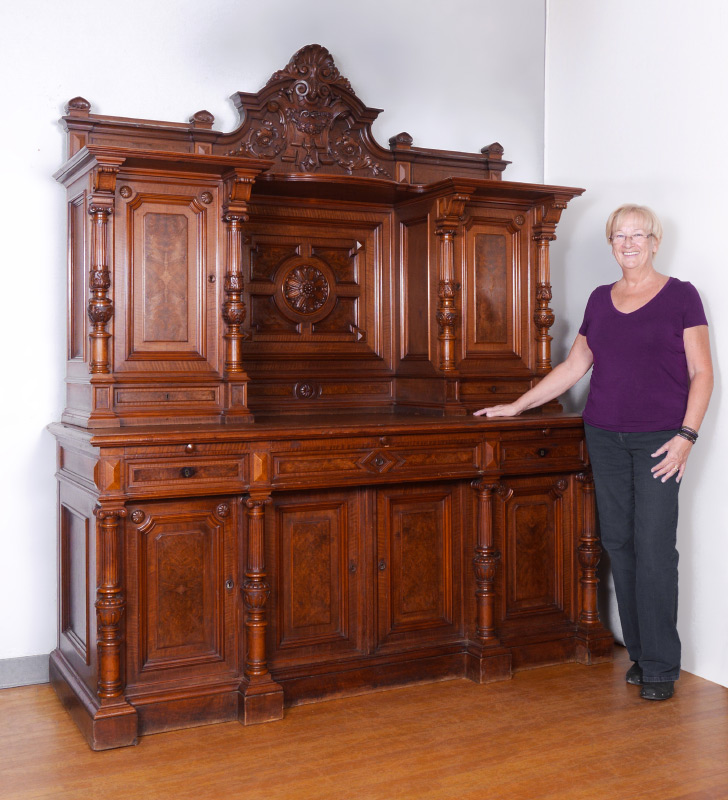 Appraisal: A GRAND HIGH VICTORIAN CARVED SIDEBOARD Carved and shaped crest