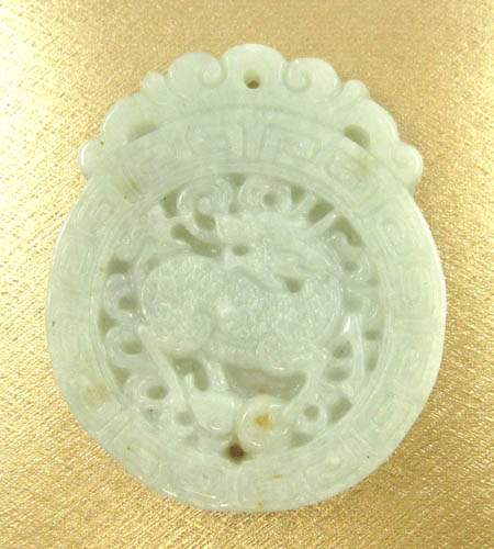 Appraisal: CHINESE GREEN JADE PENDANT the large light green jade carved