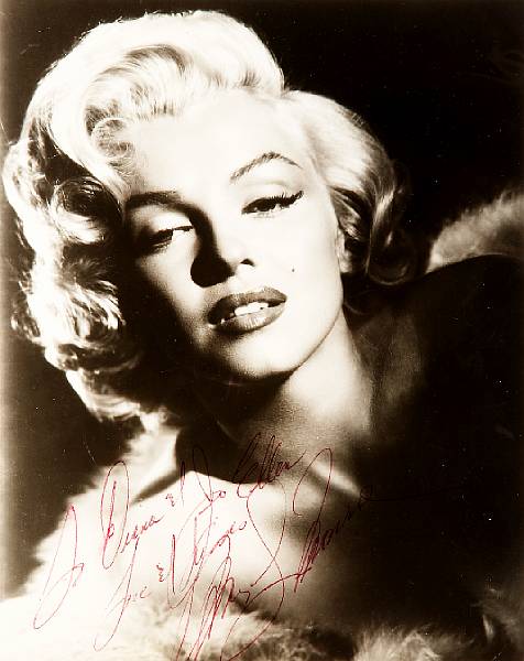 Appraisal: A Marilyn Monroe signed black and white photograph circa A