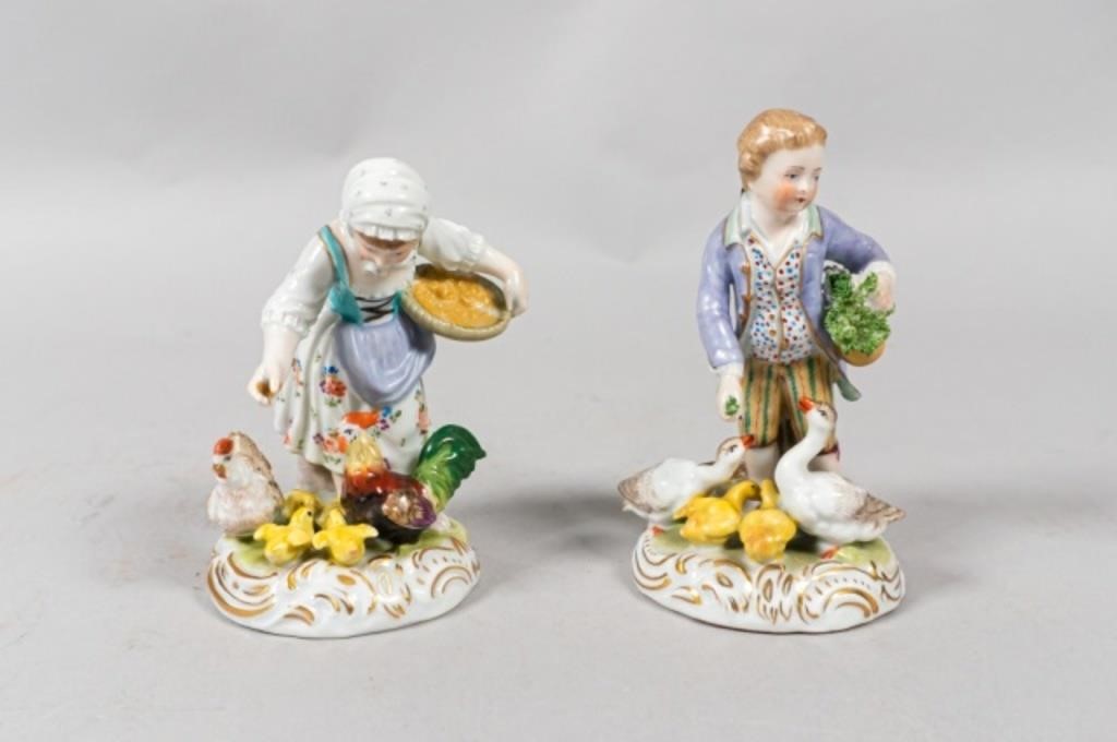 Appraisal: A pair of Dresden porcelain figurines a young boy and