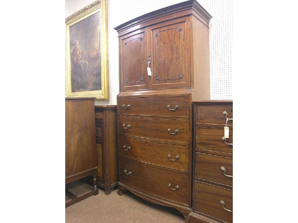 Appraisal: An early th century gentleman's cupboard bow-fronted pair of panelled