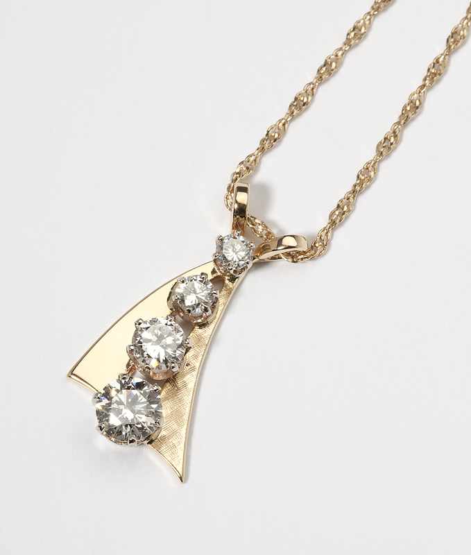 Appraisal: Tested K gold pendant set with four round brilliant-cut diamonds