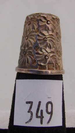 Appraisal: German sterling thimble with floral pattern