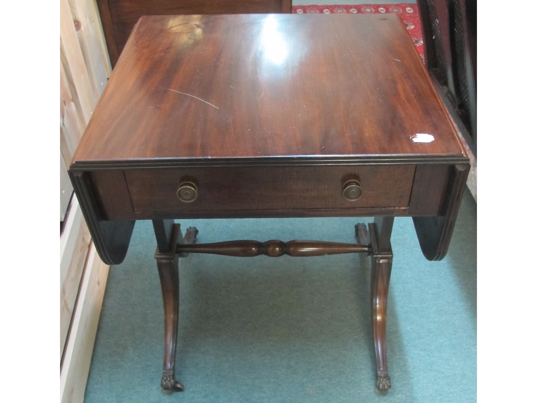 Appraisal: A Victorian mahogany sofa table