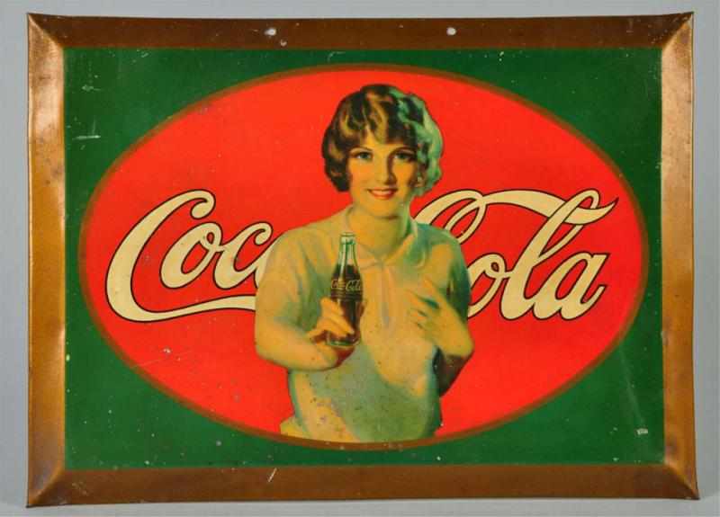 Appraisal: Small Tin Coca-Cola Sign Description Classic girl with bottle on