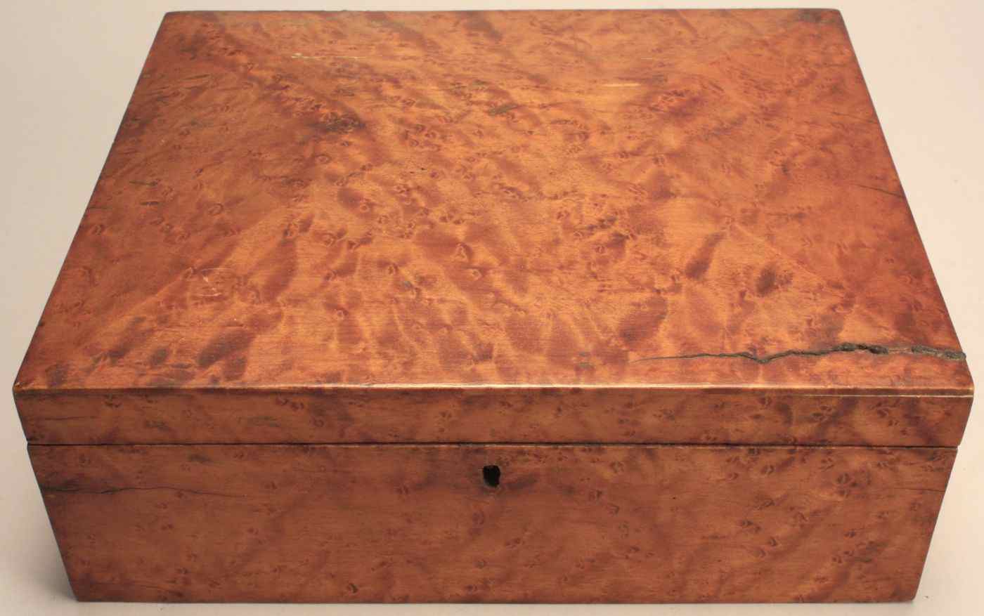 Appraisal: ANTIQUE ENGLISH LIFT-TOP DRESSER BOX th CenturyIn bird's-eye maple Height