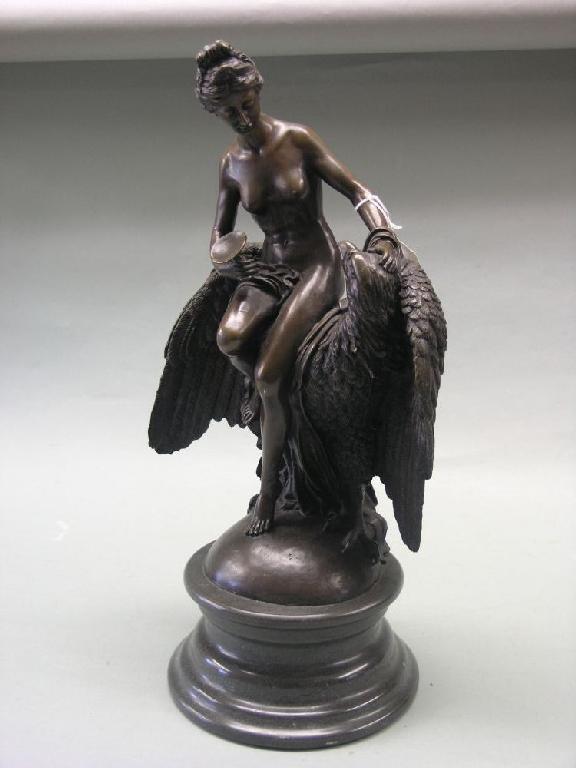 Appraisal: A reproduction bronze figure of a nude female seated upon