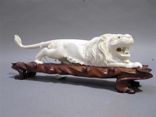 Appraisal: CHINESE CARVED IVORY FIGURE OF A RUNNING LION th C