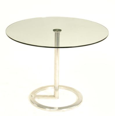 Appraisal: A chromed metal and circular glass topped table retailed by