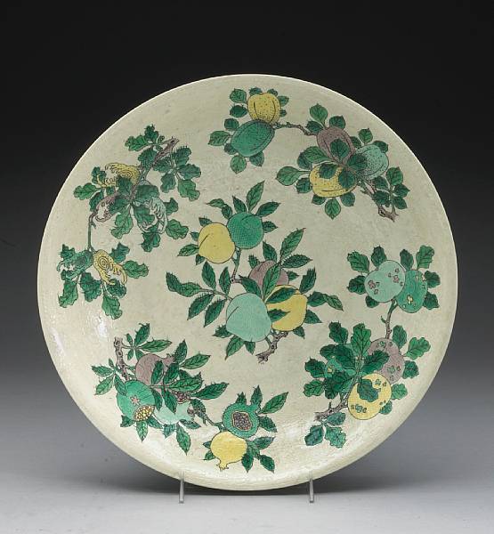 Appraisal: A famille verte and sgraffiato-decorated porcelain plate Kangxi Mark Late