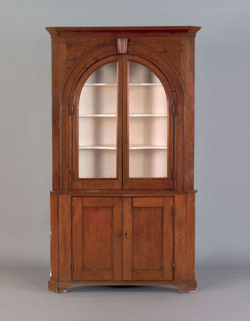 Appraisal: Pennsylvania walnut architectural corner cupboard in two parts ca the