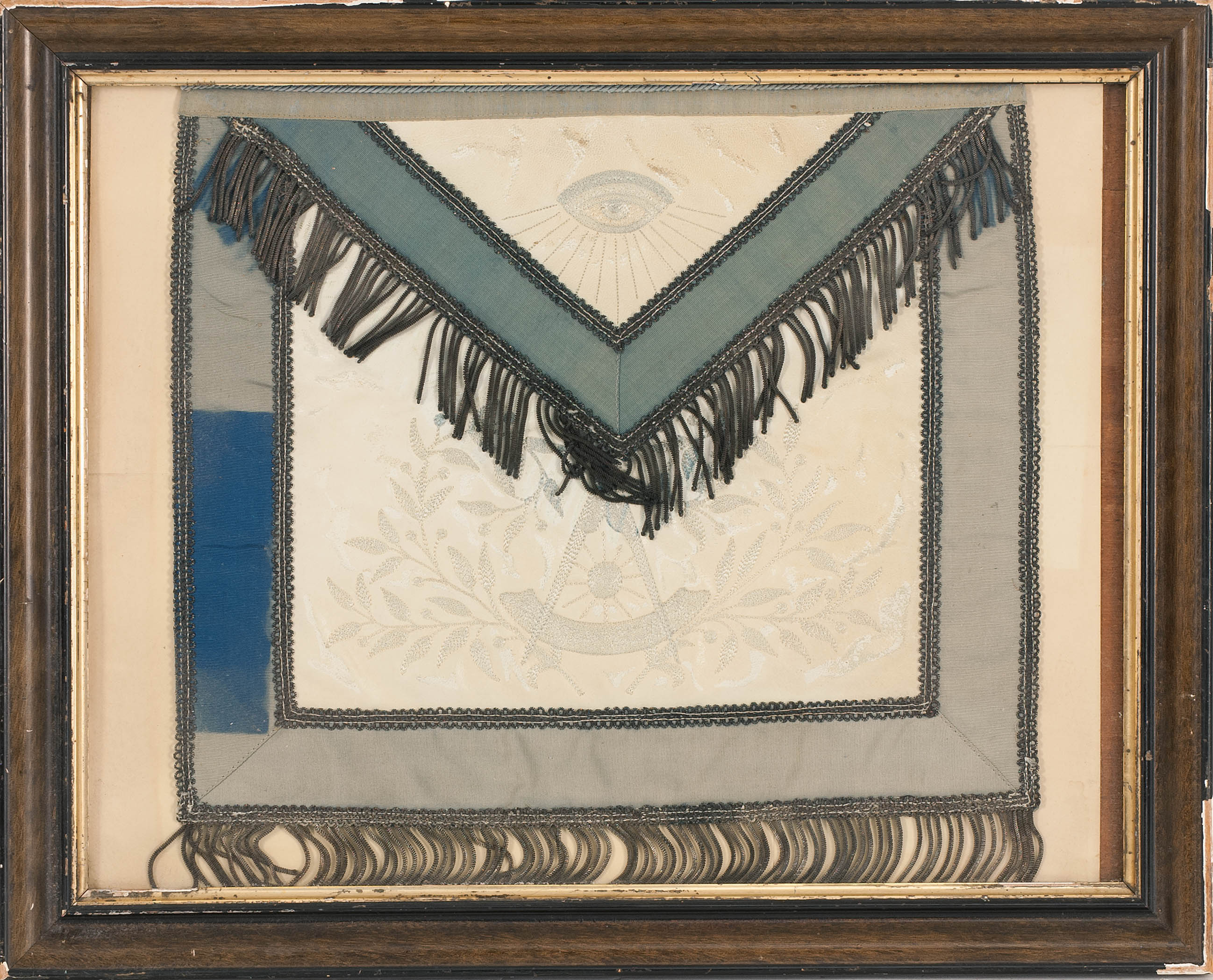 Appraisal: FRAMED MASONIC APRON In white leather with blue grosgrain edge