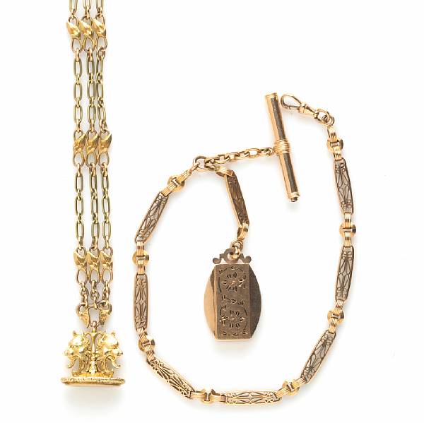 Appraisal: Two k gold watch chains with fobs gross weight approximately