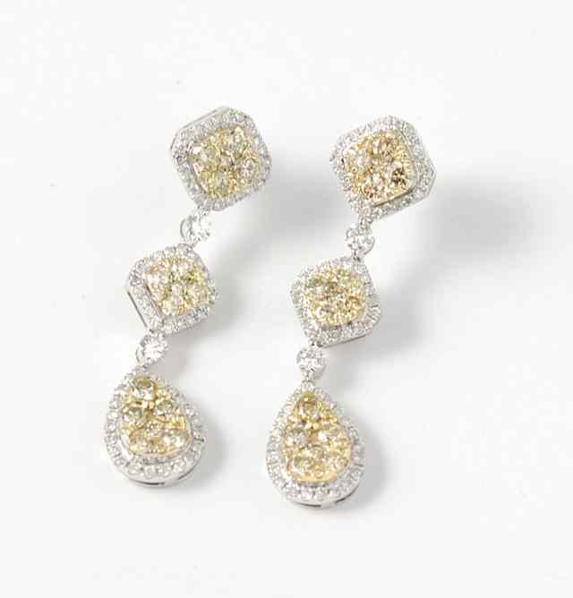 Appraisal: WHITE DIAMONDS CANARY DIAMONDS AND FOURTEEN KARAT WHITE GOLD PENDANT