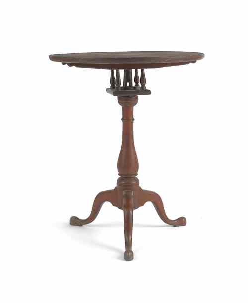 Appraisal: Pennsylvania walnut candlestand ca with a tilting dish top and