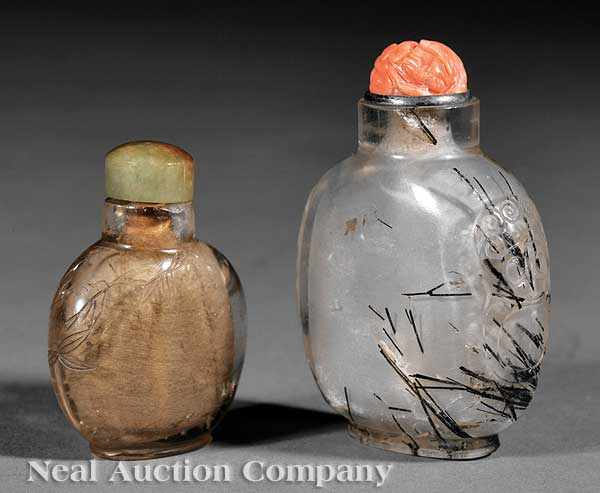 Appraisal: Two Chinese Carved Quartz Snuff Bottles the first hair crystal