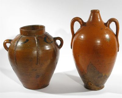 Appraisal: An earthenware vase with three lug handles incised to the