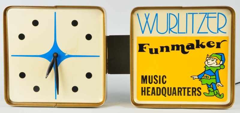 Appraisal: Wurlitzer Funmaker Music Headquarters Clock Description Working Face of clock