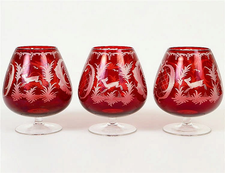 Appraisal: THREE BOHEMIAN RUBY CUT TO CLEAR BRANDY SNIFTERS th Century