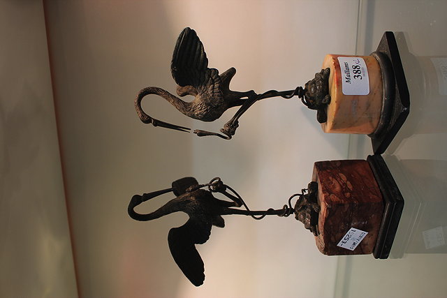 Appraisal: A NEAR PAIR OF TH CENTURY BRONZE SCULPTURES OF CRANES