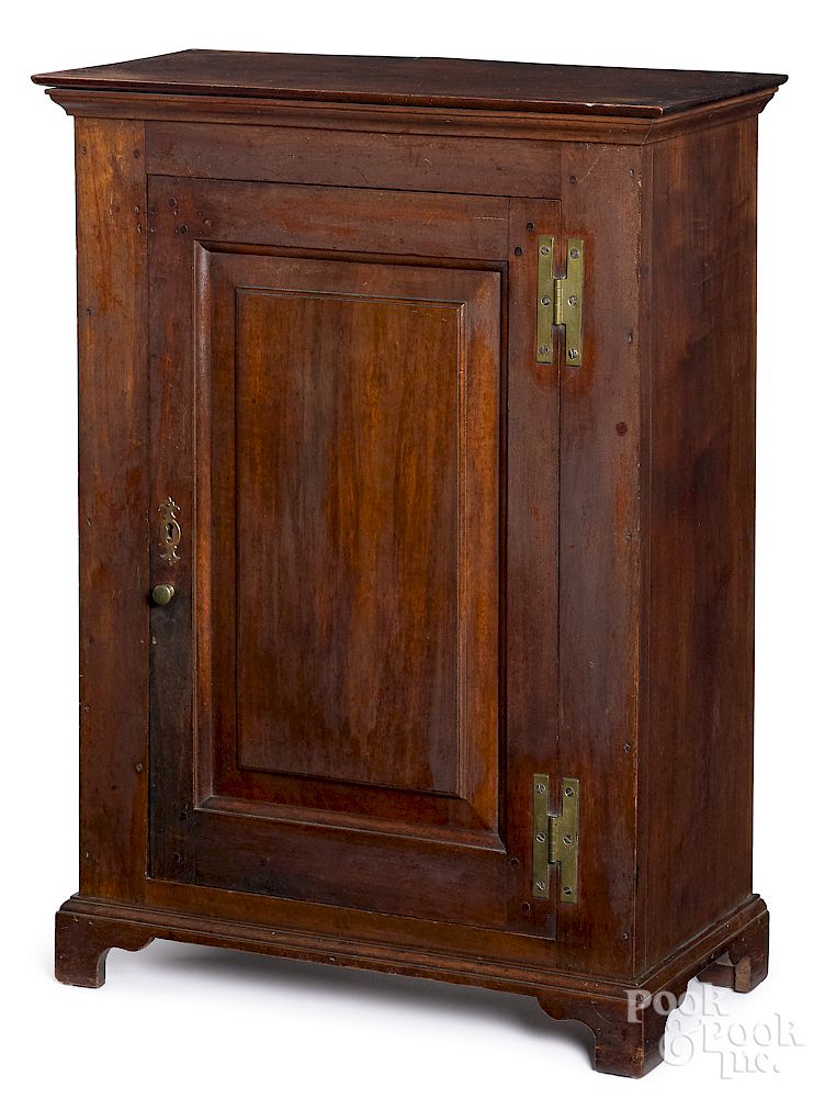 Appraisal: Diminutive Pennsylvania walnut cabinet Diminutive Pennsylvania walnut raised panel cabinet