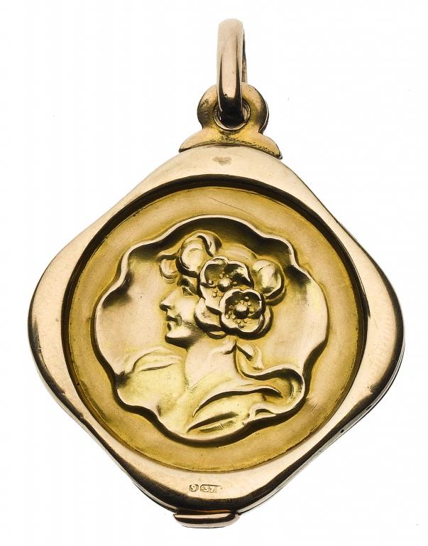 Appraisal: AN ART NOUVEAU GOLD LOCKET embossed with the head of