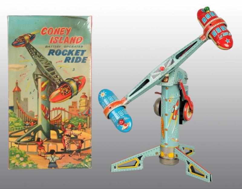 Appraisal: Tin Coney Island Rocket Ride Battery-Operated Toy Description Japanese Working