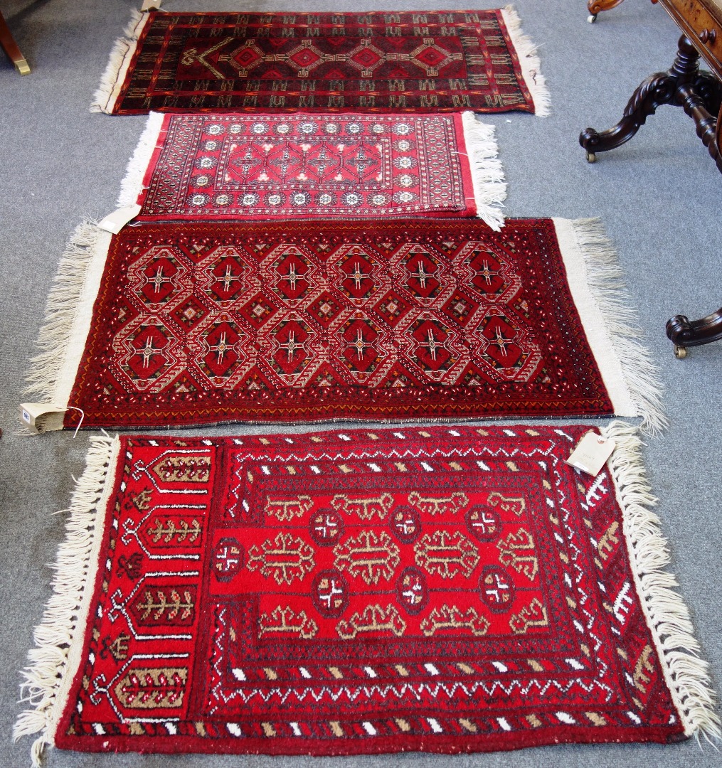 Appraisal: A Beluchistan rug the madder field with an interconnecting design