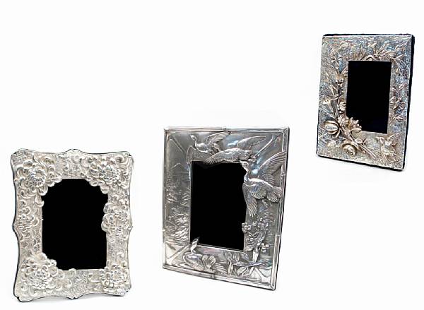 Appraisal: A group of three silver faced photo frames after the