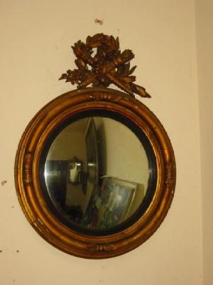 Appraisal: A REGENCY CARVED GILT WOOD AND GESSO CONVEX MIRROR the