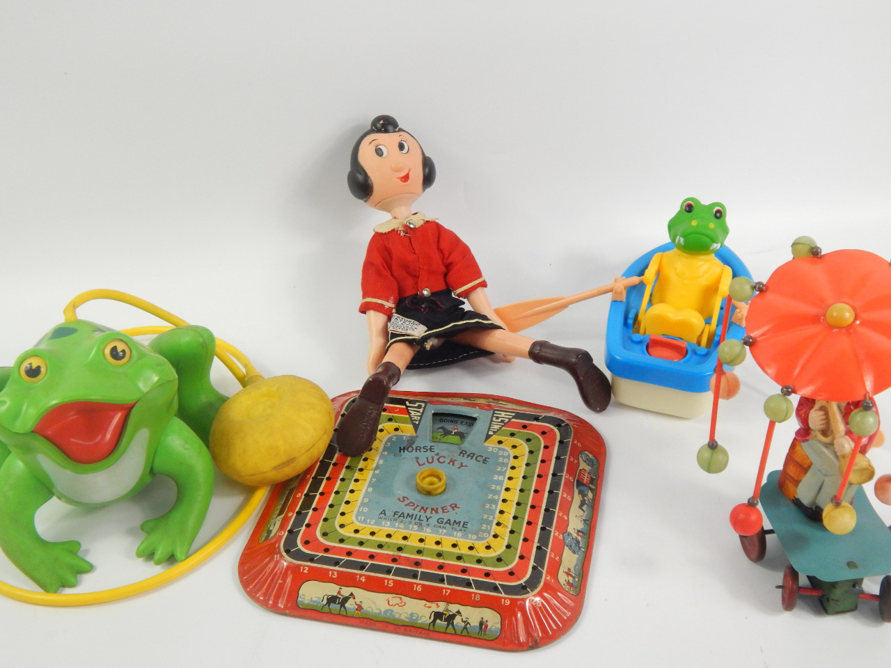 Appraisal: A collection of tin plate and other toys including a