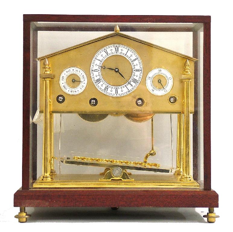 Appraisal: Small brass four train congreve style rolling ball clock within