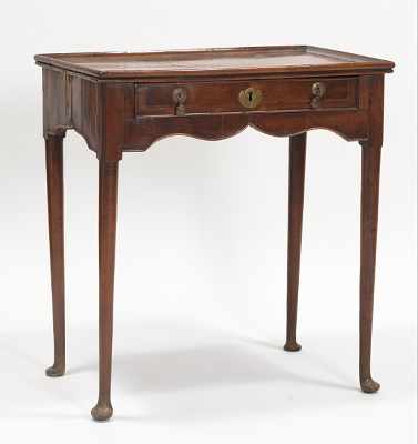 Appraisal: A George II Walnut Lowboy Lovely lowboy or dressing table