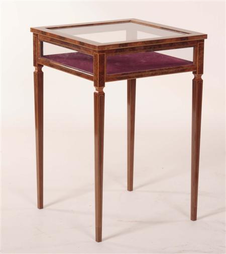 Appraisal: A burrwood bijouterie table the crossbanded glazed lid over glazed