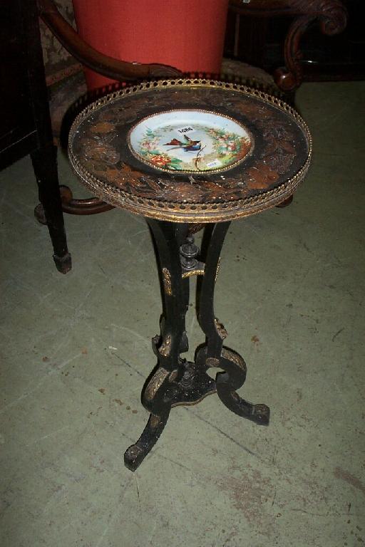 Appraisal: A Victorian occasional table the ebonised framework comprising on three