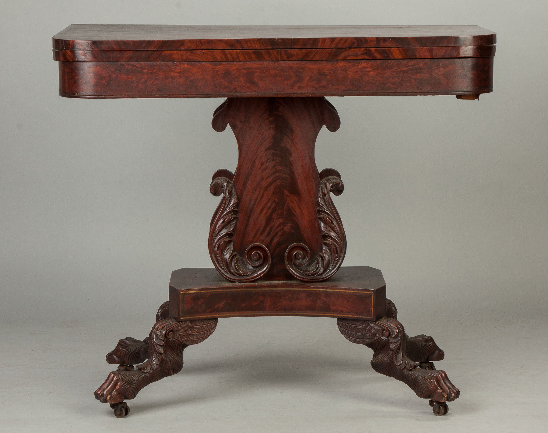 Appraisal: American Figured Mahogany Card Table C Carved lyre base and