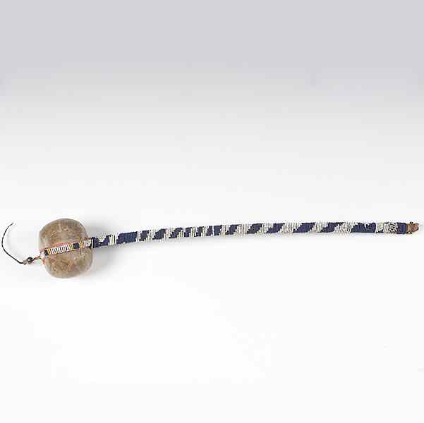 Appraisal: Plains Beaded Stone Club sinew-wrapped blue and white beadwork handle